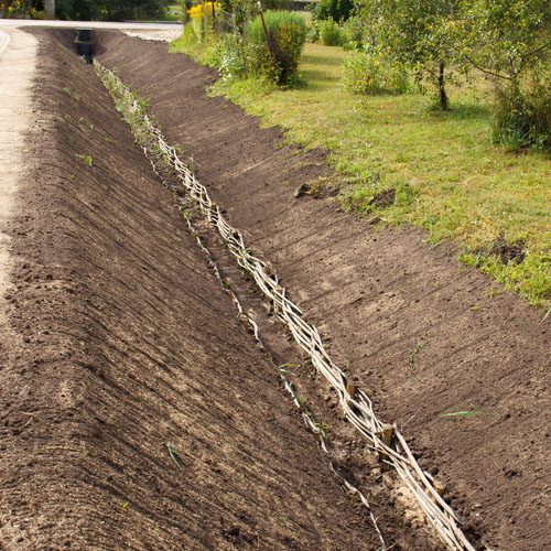 Land drainage / Ditching. <br>
      Removal of excess surface and subsurface water from the land to enhance crop growth, including the removal of soluble salts from the soil. 